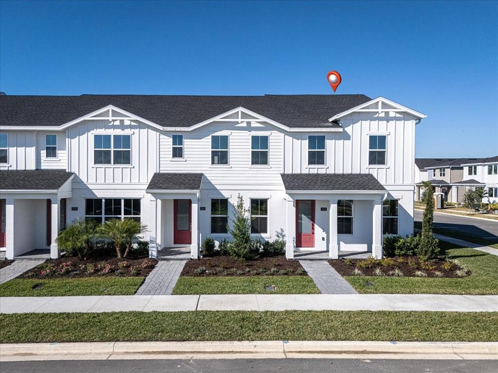 1850 Falconhurst Lane Apopka, FL 32703 - Photo 5 of 73 a front view of a house with a yard