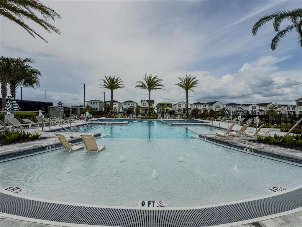 1850 Falconhurst Lane Apopka, FL 32703 - Photo 61 of 73 a view of a swimming pool and lounge chair