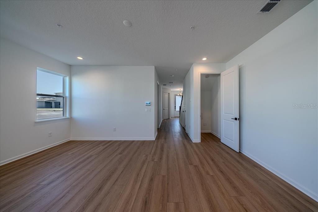 1850 Falconhurst Lane Apopka, FL 32703 - Photo 10 of 73 a view of a room with wooden floor and a window