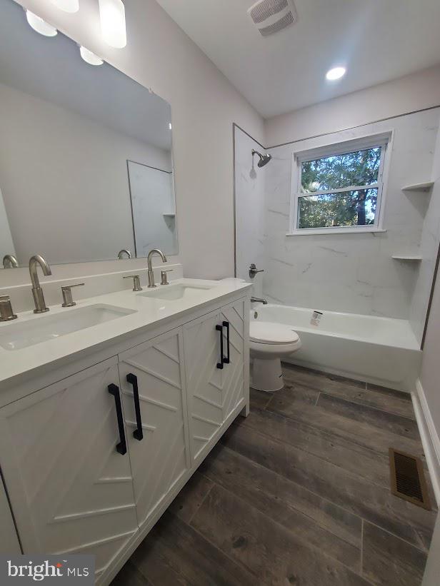336 Pardee Boulevard Browns Mills, NJ 08015 - Photo 20 of 32 a bathroom with a double vanity sink toilet and a mirror