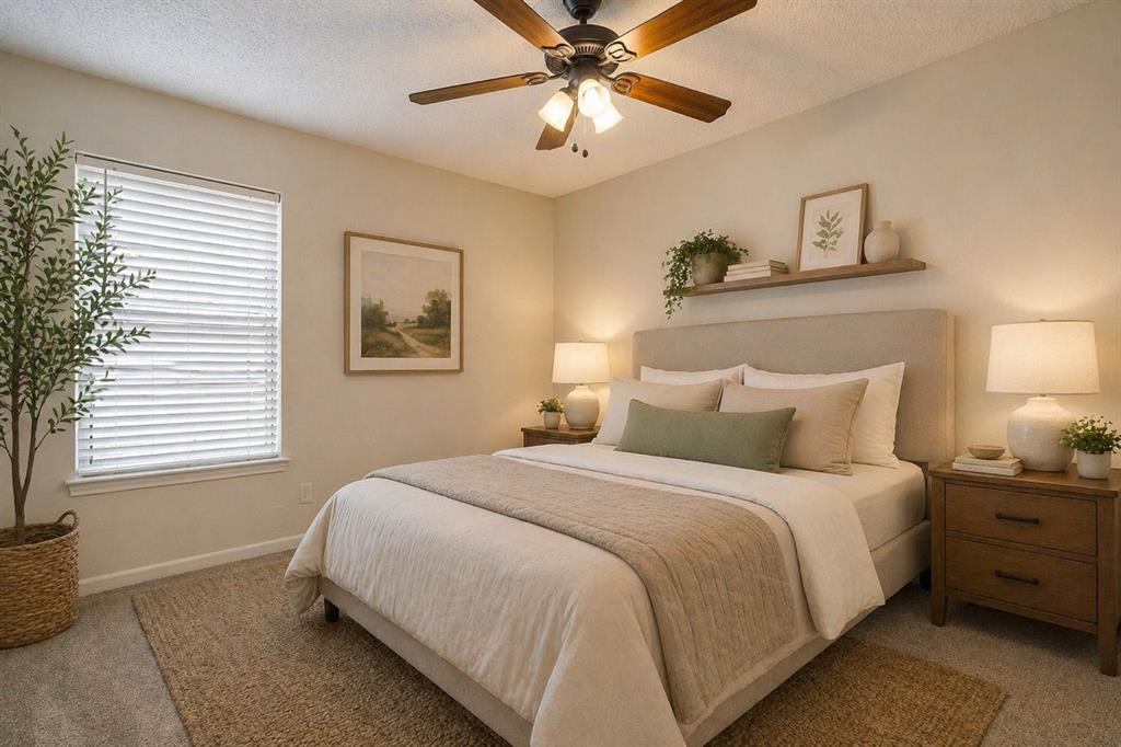8613 Silver Creek Road White Settlement, TX 76108 - Photo 21 of 40 a bedroom with a bed and a chandelier