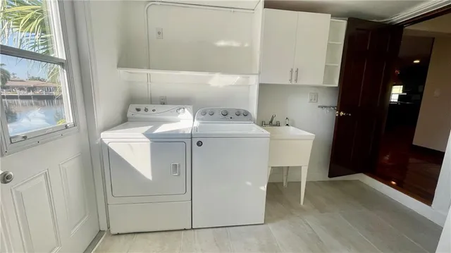 a utility room with washer and dryer