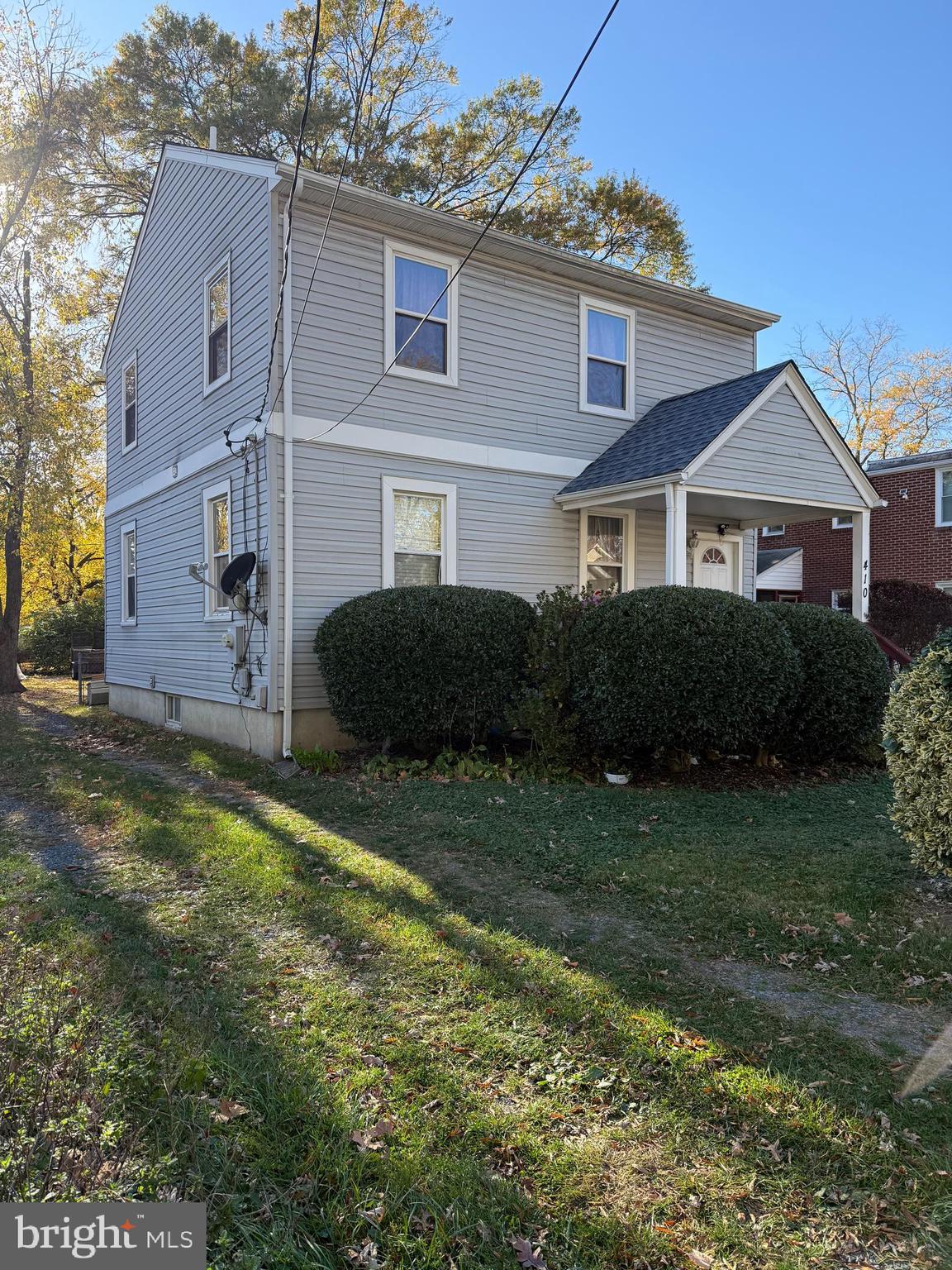 410 Carroll Avenue Laurel, MD 20707 - Photo 3 of 3 a front view of a house with a garden