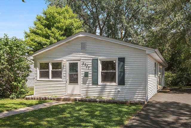a house that has a window in front of a house