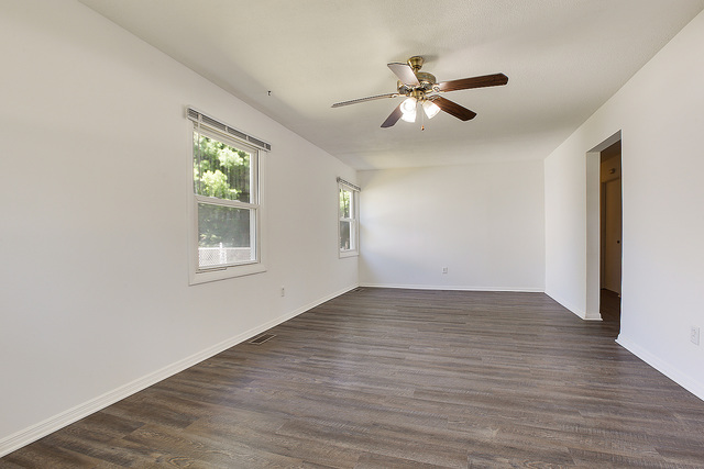 3237 Wallace Avenue Steger, IL 60475 - Photo 3 of 13 a view of an empty room with wooden floor and a window