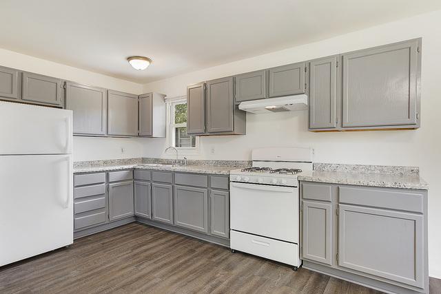 3237 Wallace Avenue Steger, IL 60475 - Photo 4 of 13 a kitchen with granite countertop white cabinets and white appliances