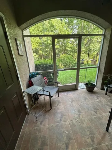 a living room with a outdoor seating space