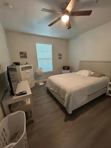 a bedroom with a bed furniture and a window