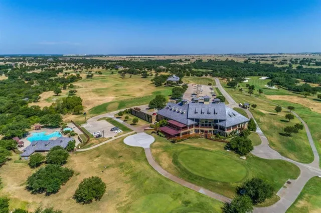 an aerial view of a house with a lake view