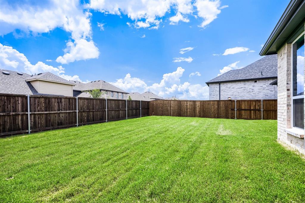 4414 Windy Point Road Oak Point, TX 75068 - Photo 26 of 27 a view of a backyard