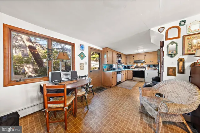 a kitchen with stainless steel appliances granite countertop a stove a refrigerator and a refrigerator