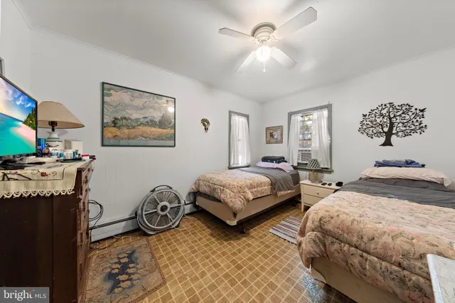 a bedroom with bed and window