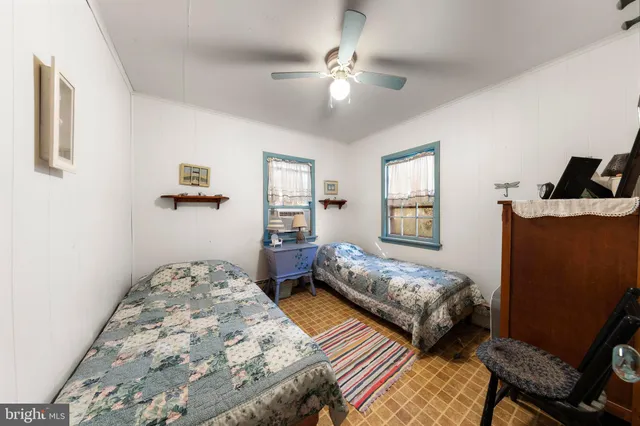 a bathroom with a sink toilet and a mirror