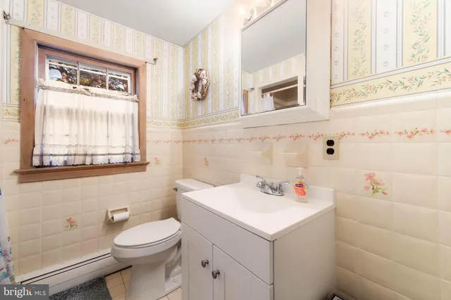 a bathroom with a granite countertop shower and a sink