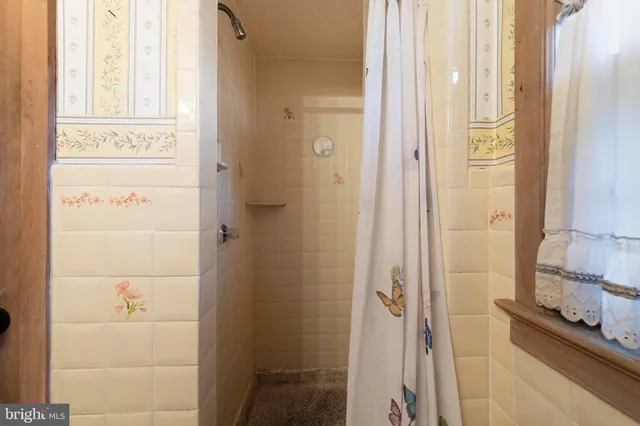 a view of a hallway with seating area