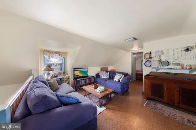a view of a dining room with furniture and window