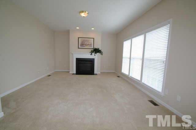 305 Rapp Lane Apex, NC 27502 - Photo 4 of 5 a view of empty room with a fireplace