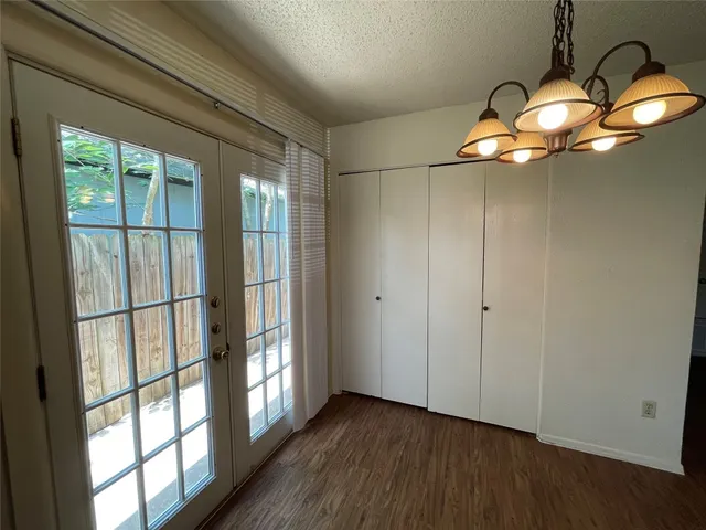 a very nice looking empty room with wooden floor