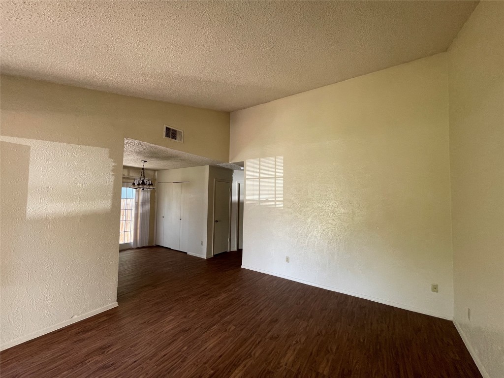 7902 Brodie Lane, Unit A Austin, TX 78745 - Photo 4 of 22 a view of empty room with wooden floor