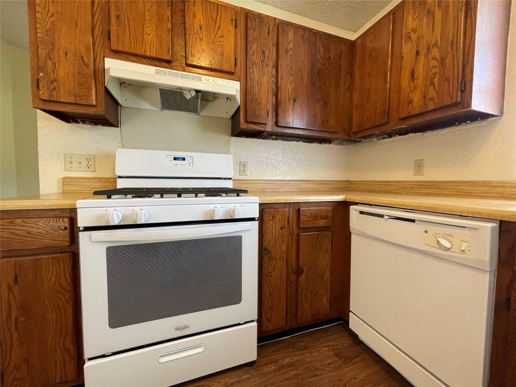 7902 Brodie Lane, Unit A Austin, TX 78745 - Photo 9 of 22 a kitchen with a stove and a microwave