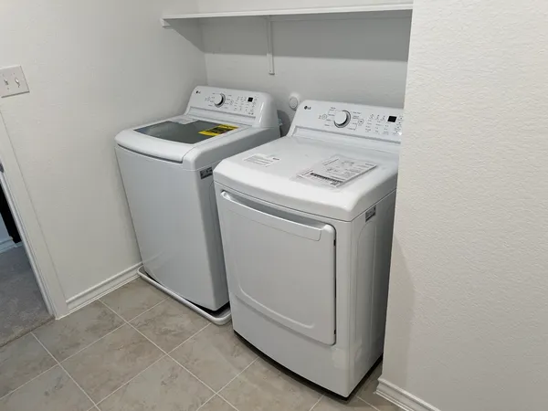 a utility room with dryer and washer