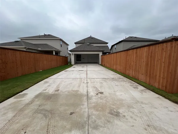 a front view of a house with yard