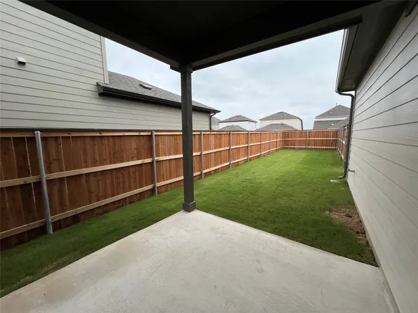 a view of a backyard with potted plants