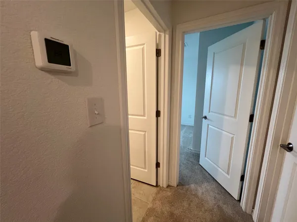 a view of a hallway and closet area
