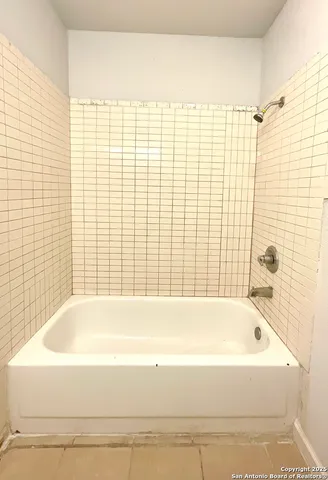 an empty room with a empty space and a window