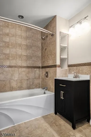 a bathroom with a bathtub and a sink