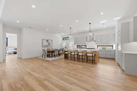 a view of kitchen with stainless steel appliances refrigerator microwave and stove