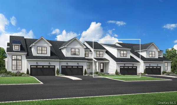 View of front of house with driveway, a garage, and a front yard