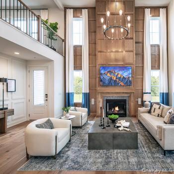 13 Fieldstone Knoll, Unit 41 Armonk, NY 10504 - Photo 2 of 11 Building lobby featuring a towering ceiling, beamed ceiling, and a decorative wall