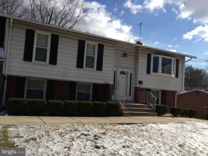 4305 Kinmount Road Lanham, MD 20706 - Photo 1 of 3 a front view of a house with a yard