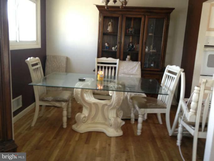 4305 Kinmount Road Lanham, MD 20706 - Photo 2 of 3 a dining room with furniture and window
