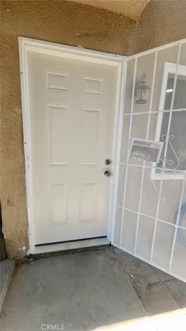 an empty room with a wooden door