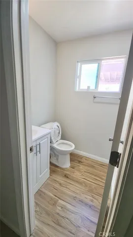 a bathroom with a toilet and a sink