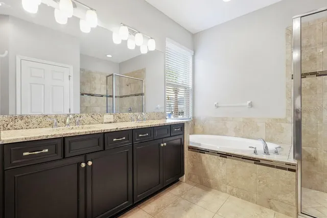 a bathroom with a bathtub and a shower