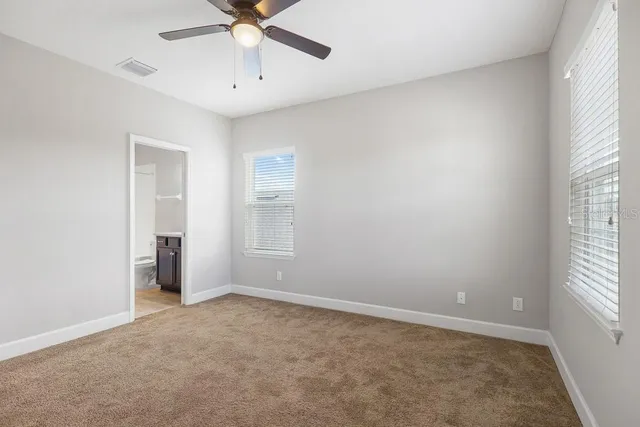 a workspace with a bookshelf and a workspace
