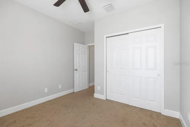a view of a hallway with entryway