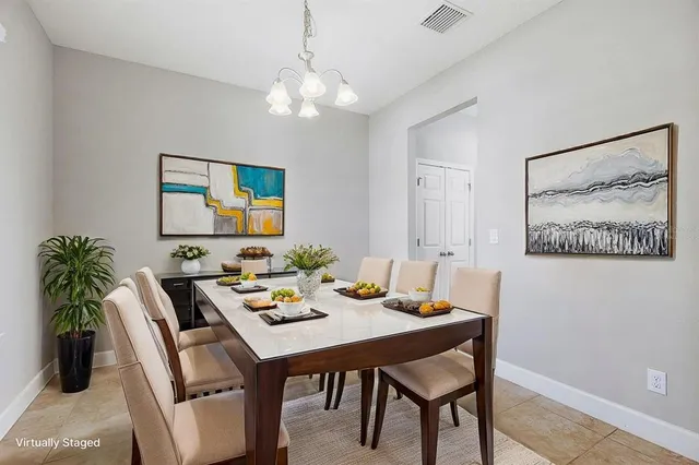 an empty room with chandelier fan