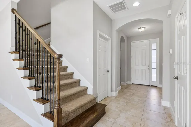 a large kitchen with stainless steel appliances granite countertop a stove and a refrigerator
