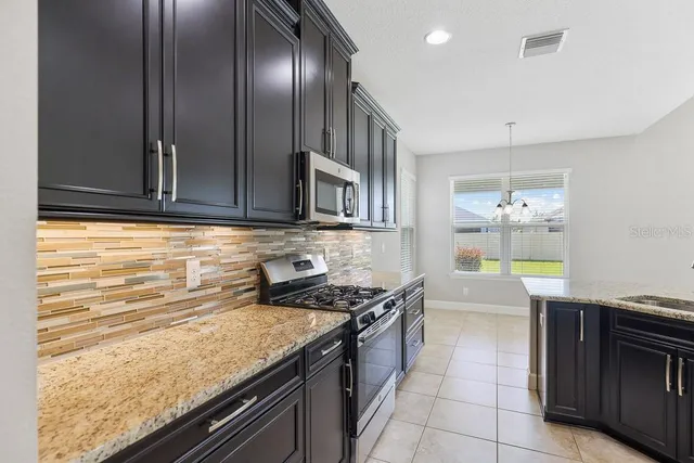 a kitchen with a sink counter top space and appliances