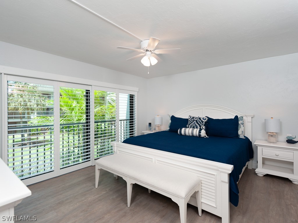 760 Sextant Drive, Unit 732 Sanibel, FL 33957 - Photo 19 of 35 a bed room with a bed and a window