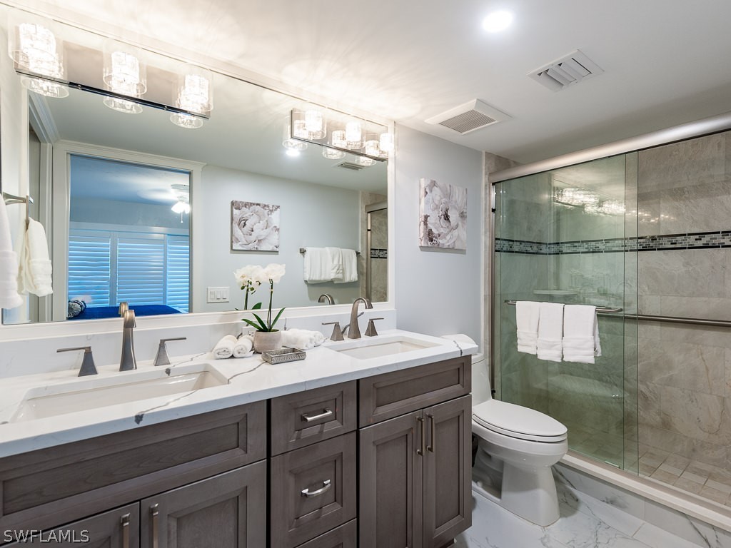 760 Sextant Drive, Unit 732 Sanibel, FL 33957 - Photo 22 of 35 a bathroom with a sink a toilet and shower