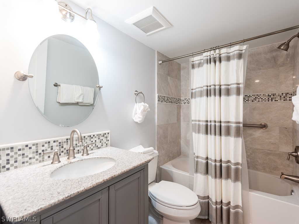 760 Sextant Drive, Unit 732 Sanibel, FL 33957 - Photo 24 of 35 a bathroom with a granite countertop sink toilet and shower