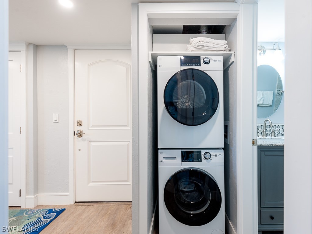 760 Sextant Drive, Unit 732 Sanibel, FL 33957 - Photo 25 of 35 a utility room with dryer and washer