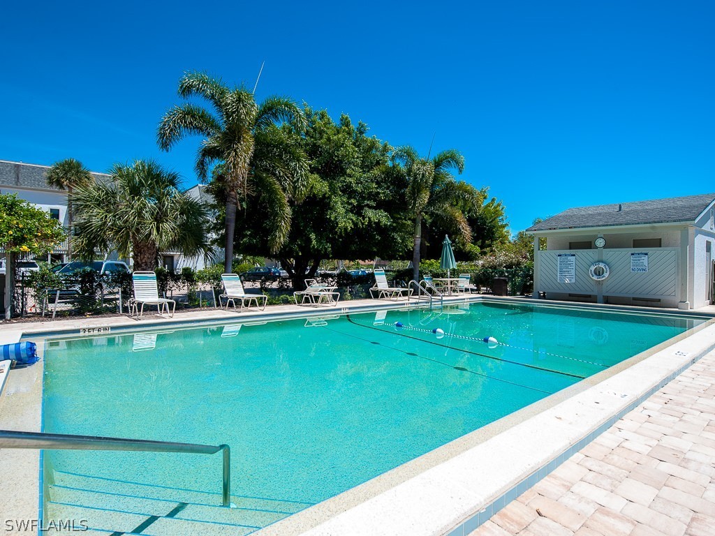 760 Sextant Drive, Unit 732 Sanibel, FL 33957 - Photo 30 of 35 a view of swimming pool with outdoor seating and deck