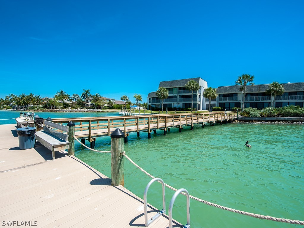 760 Sextant Drive, Unit 732 Sanibel, FL 33957 - Photo 34 of 35 a view of a house with a yard and sitting area