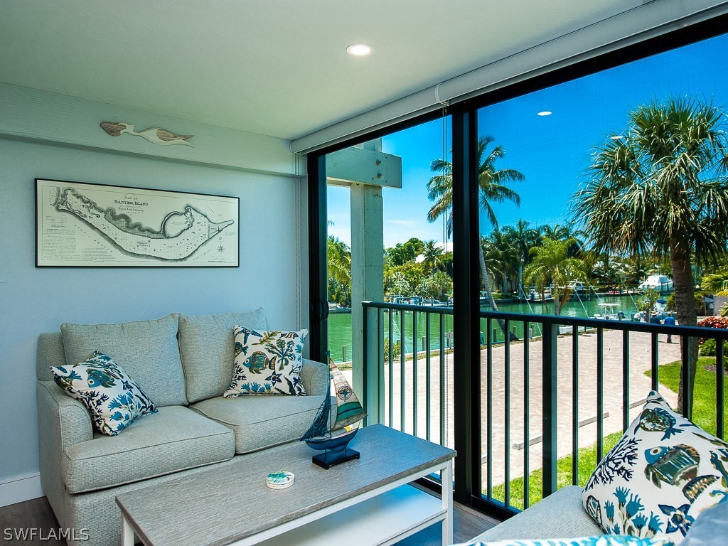 760 Sextant Drive, Unit 732 Sanibel, FL 33957 - Photo 6 of 35 a living room with furniture and a large window